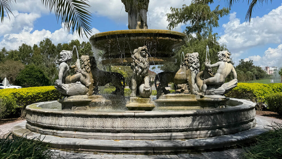 a fountain with statues of lions and lions