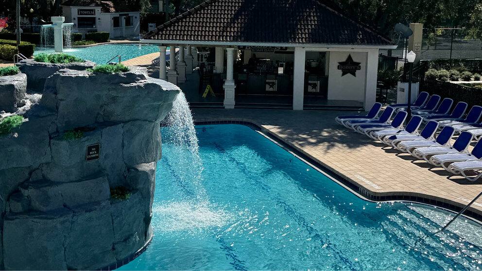 a pool with a waterfall