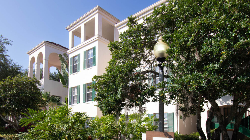 a building with trees and plants