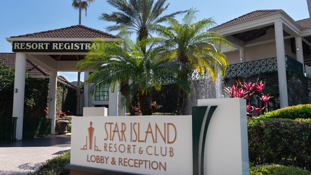 a sign in front of a hotel