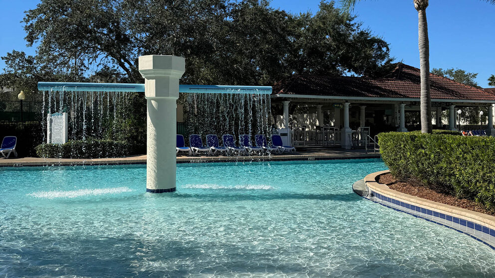 a pool with a waterfall