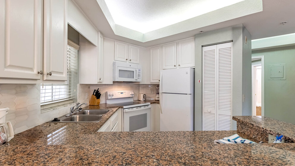 a kitchen with a marble counter top