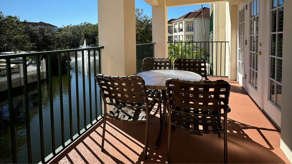 a table and chairs on a balcony