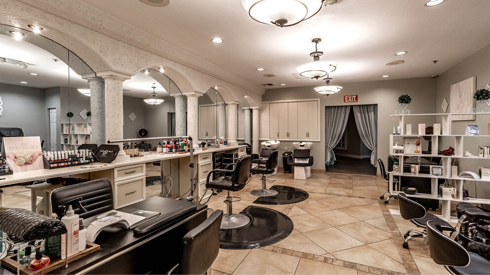 a room with chairs and mirrors