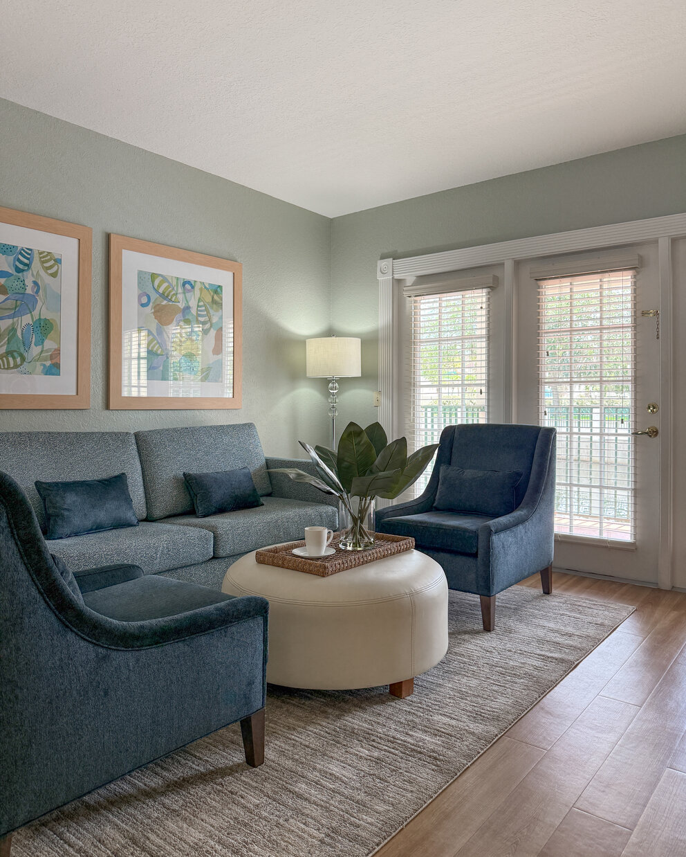 a living room with a couch and chairs